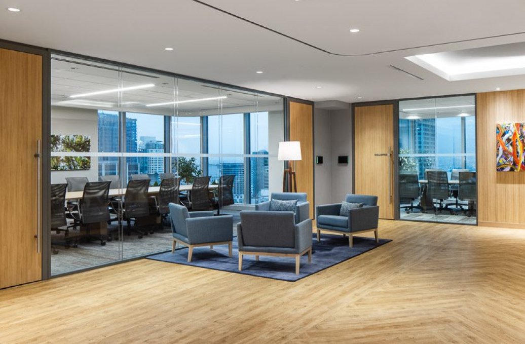 alt="Movable glass walls installed by Systemax in modern office space."