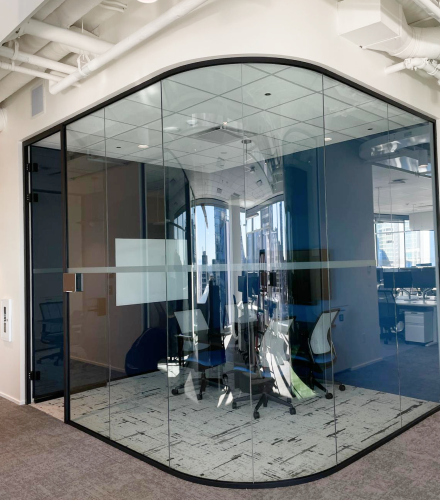 alt="Movable curved walls installed by Systemax in modern office space."